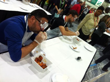 American consumers are crazy about chicken wings. During the IPPE there was a hot chicken wing eating competition, with wings so spicy, special precautions had to be taken. Photo: Fabian Brockotter American consumers are crazy about chicken wings. During the IPPE there was a hot chicken wing eating competition, with wings so spicy, special precautions had to be taken. Photo: Fabian Brockotter