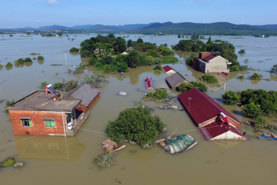 Overview of trees and houses submerged by floodwater in a village in Xuancheng, in east China's Anhui province. <em>Photo: ANP/ STR</em>