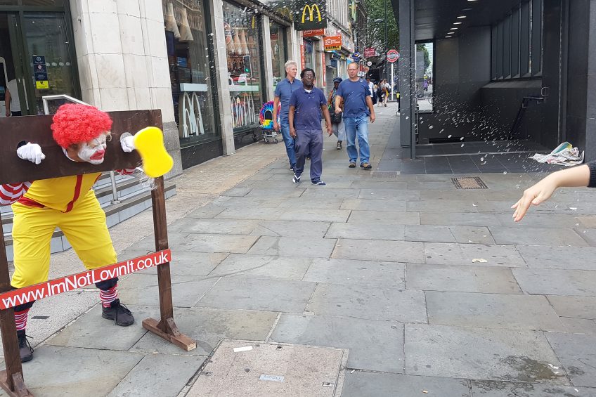 Ronald in the stocks in McDonald s chicken protest
