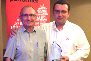 Matthew Wilson, Cobb technical service manager (right), presenting the award to Dr László KQrösi.